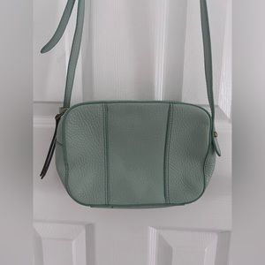 lightly used turquoise fossil cross body purse